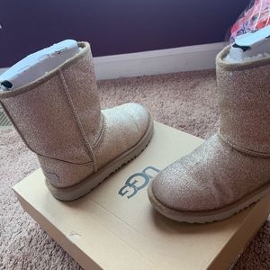 One pair of gold Ugg’s and one pair of brown Ugg’s